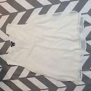 Light cream sleeveless layered blouse